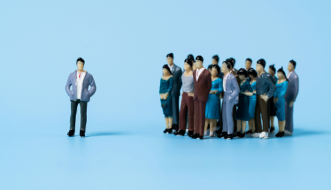 a group of miniature figures on a blue background