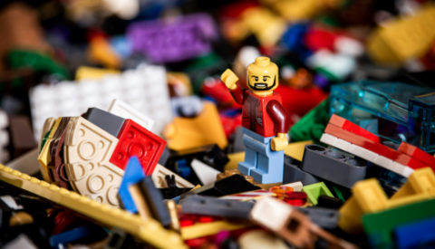 lego mini figure on background of lego bricks